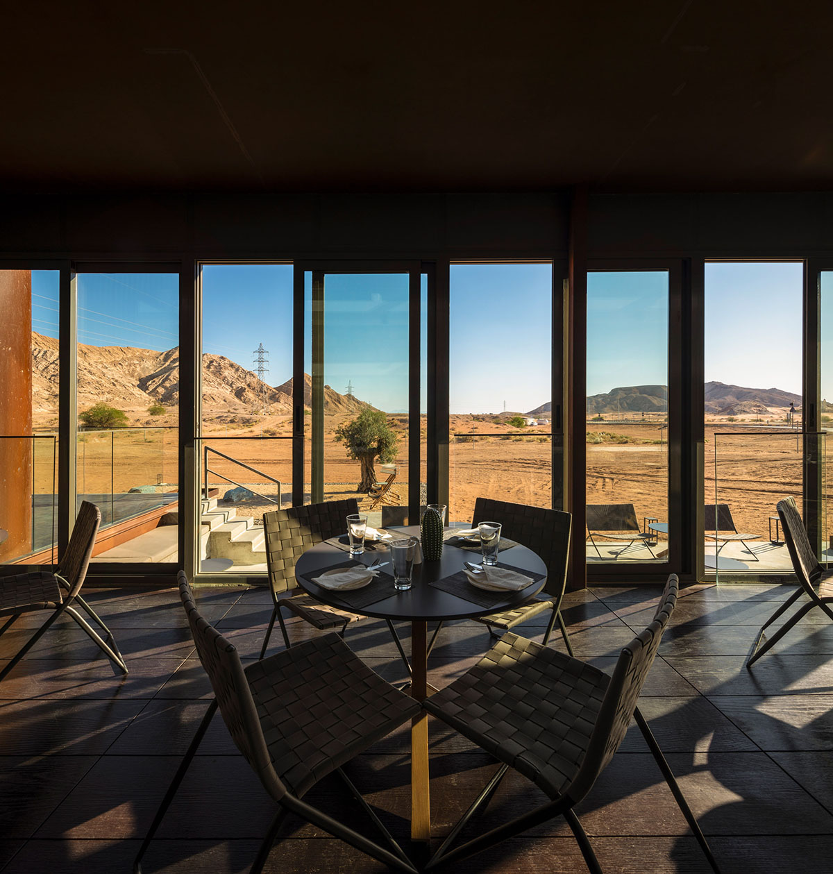 Anarchitect nestles this earth color hotel and spa building into the prehistoric of UAE