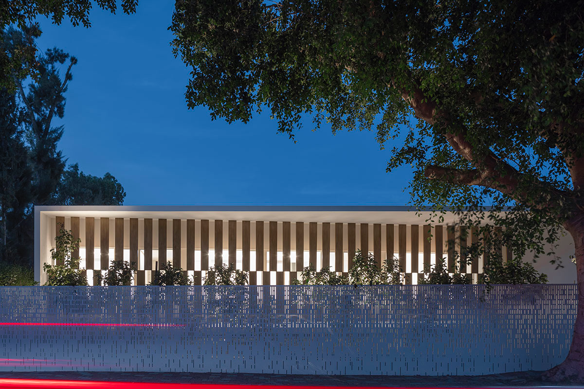 Large sunken yard defines the program of Split House designed by Pitsou Kedem Architects in Israel