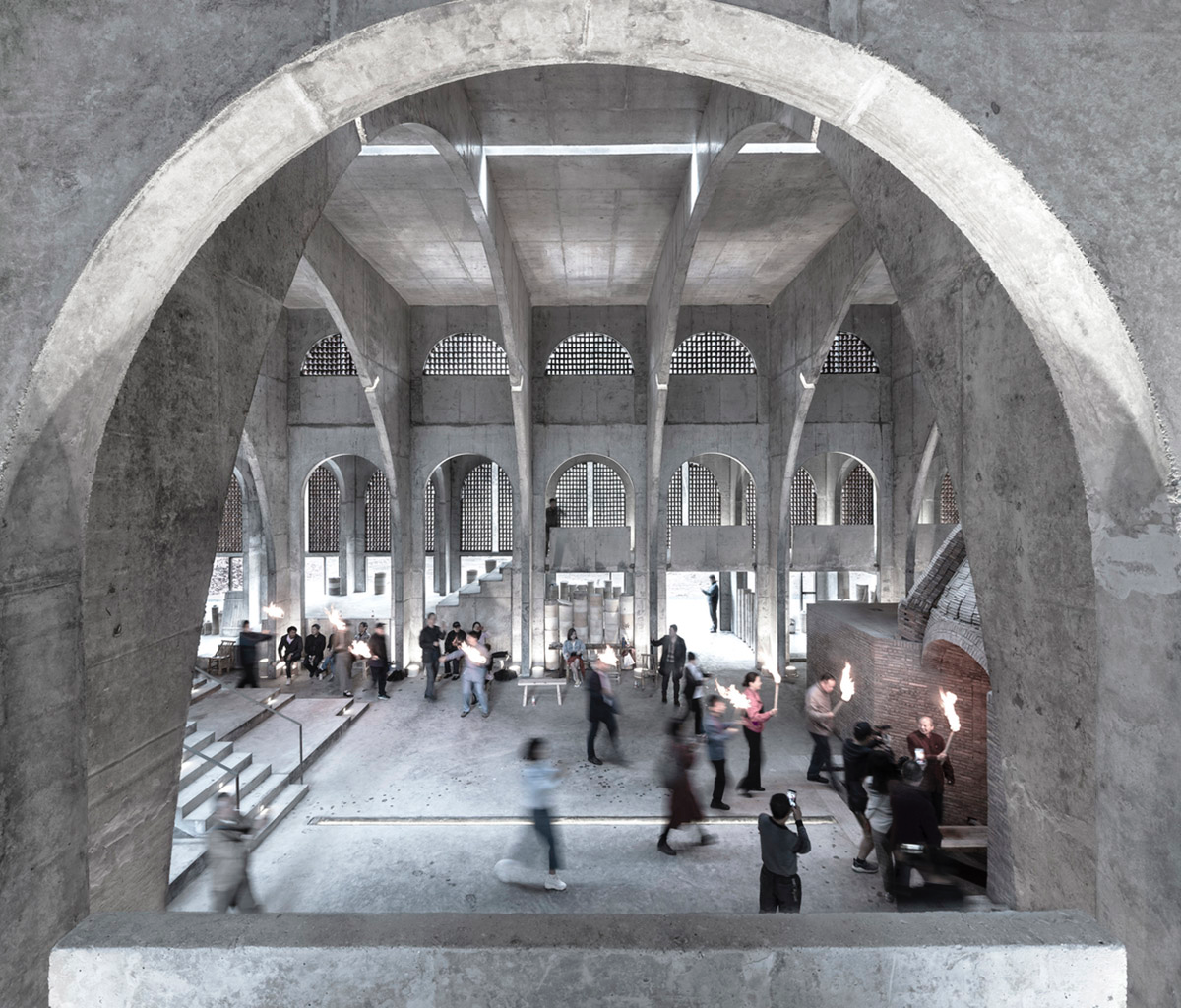 AZL Architects renovates old kiln building with concrete and brick arches in the middle of a forest
