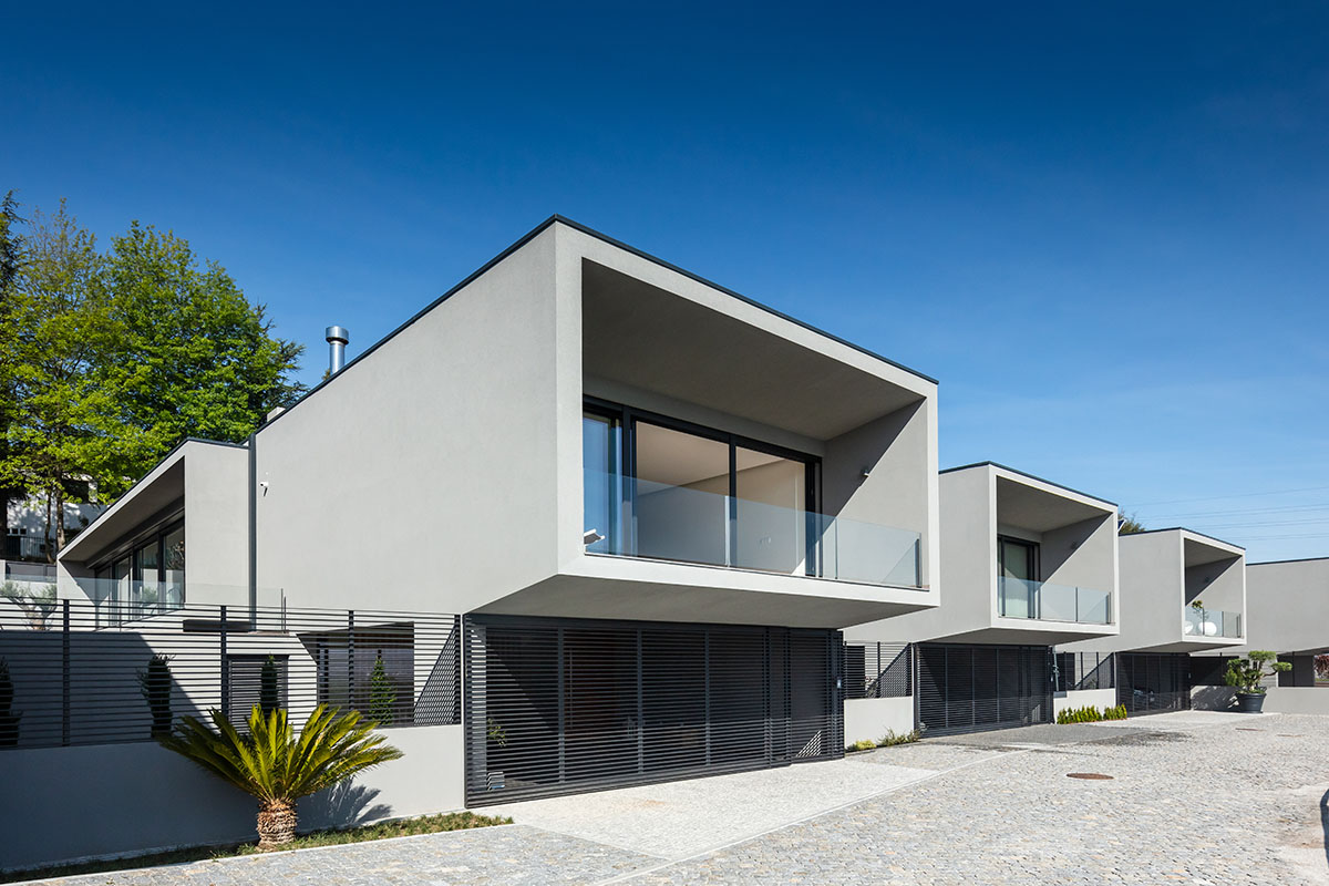 Grupo Zegnea's linear Portuguese houses create fluidity of space with large openings towards nature
