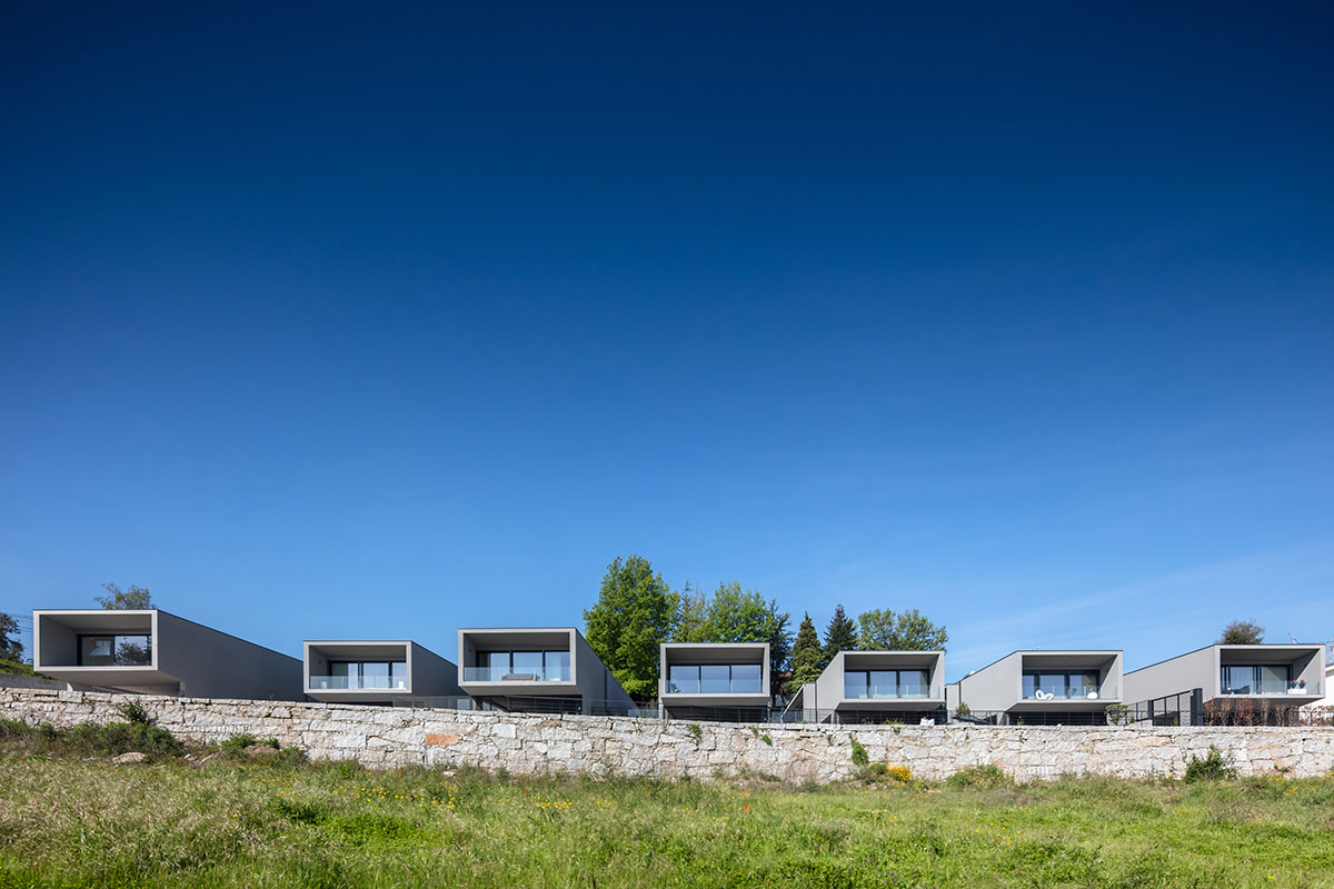 Grupo Zegnea's linear Portuguese houses create fluidity of space with large openings towards nature