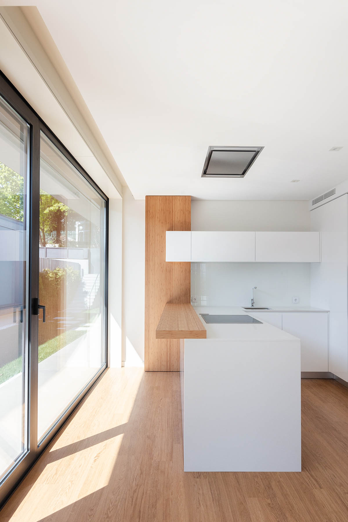 Grupo Zegnea's linear Portuguese houses create fluidity of space with large openings towards nature