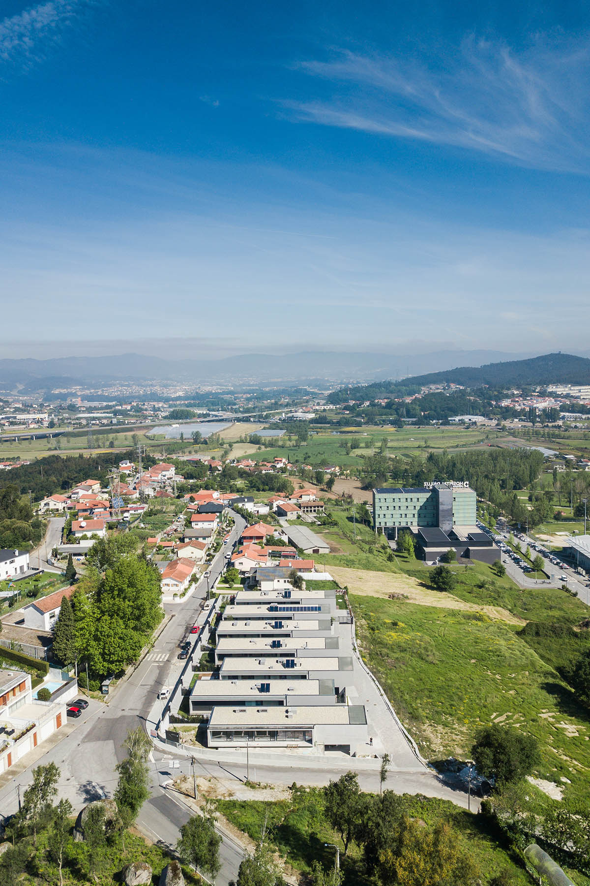 Grupo Zegnea's linear Portuguese houses create fluidity of space with large openings towards nature