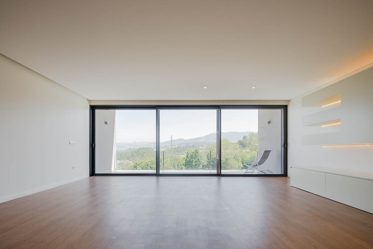 Grupo Zegnea's linear Portuguese houses create fluidity of space with large openings towards nature