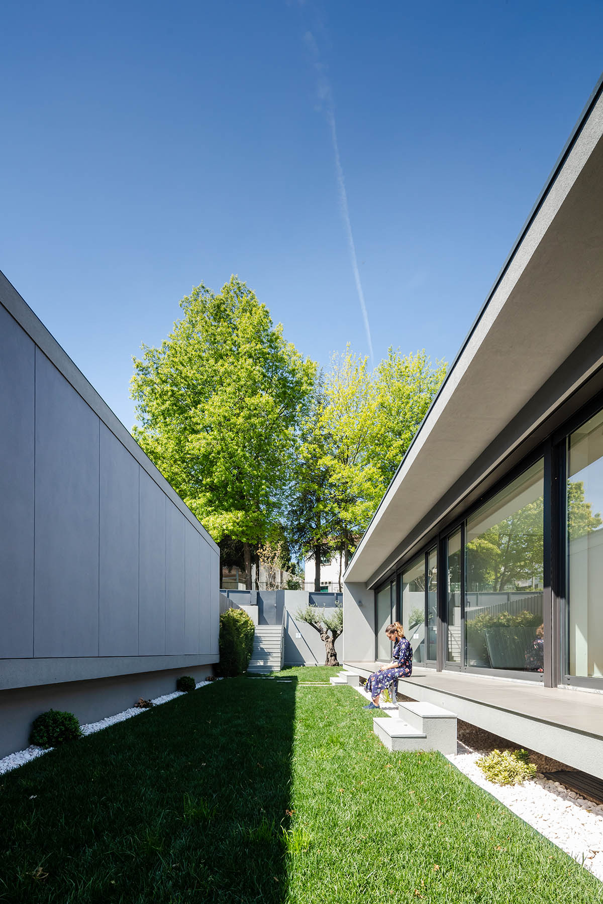 Grupo Zegnea's linear Portuguese houses create fluidity of space with large openings towards nature