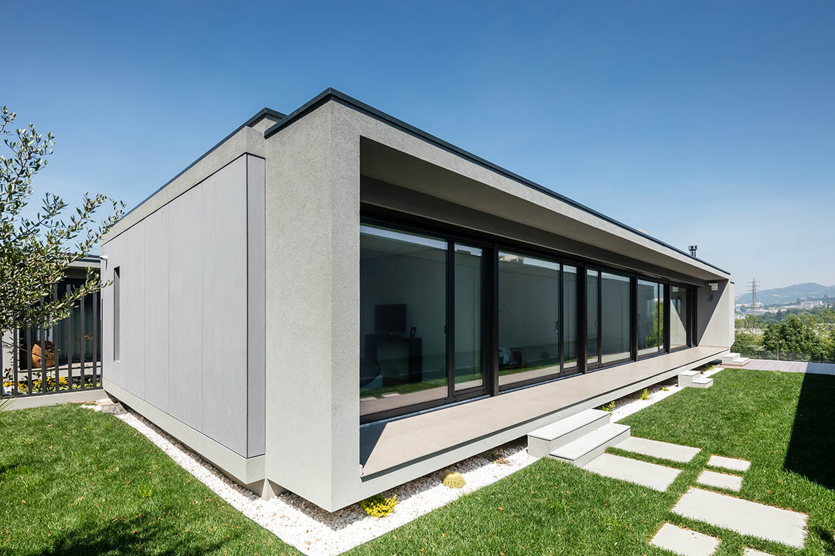 Grupo Zegnea's linear Portuguese houses create fluidity of space with large openings towards nature