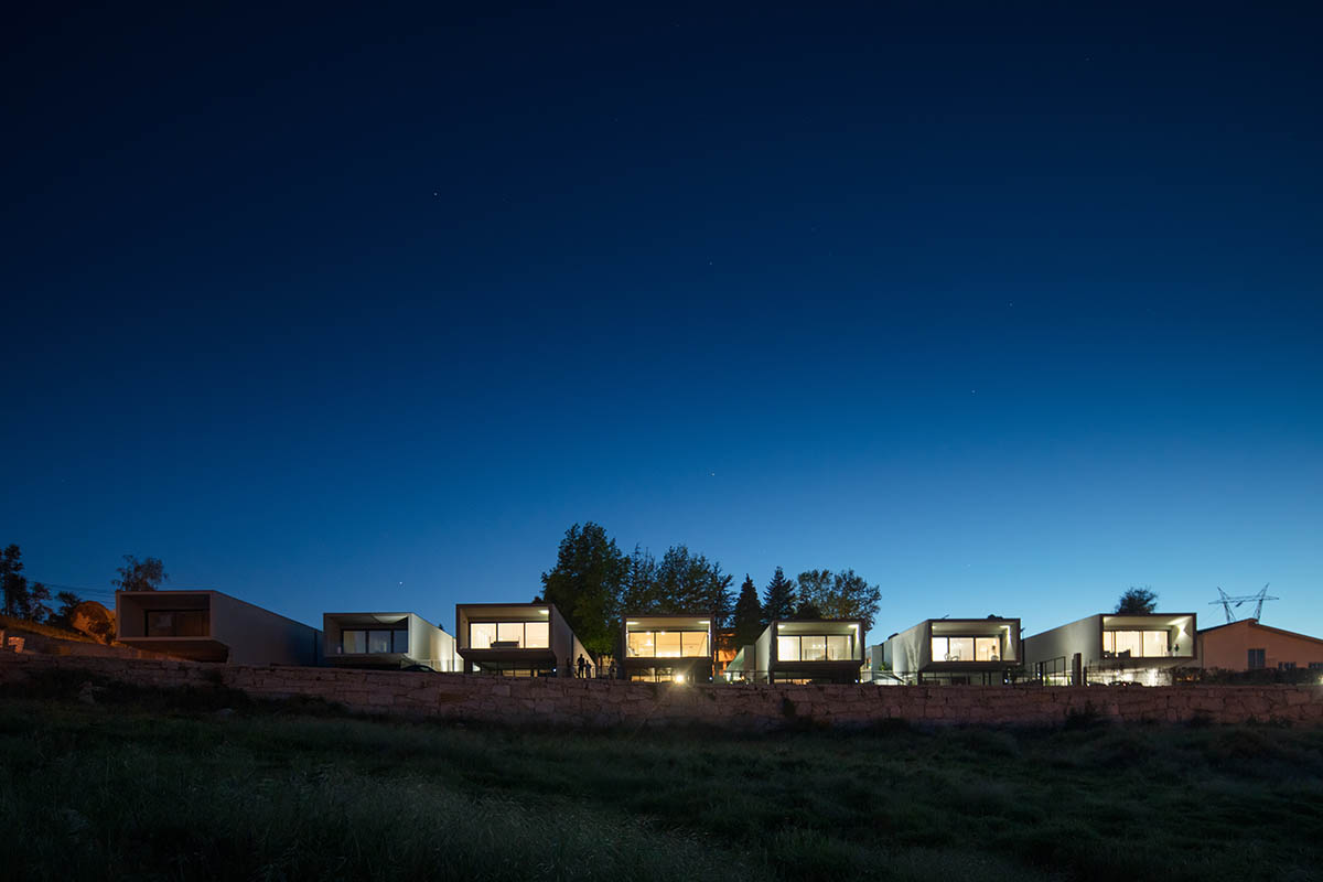 Grupo Zegnea's linear Portuguese houses create fluidity of space with large openings towards nature