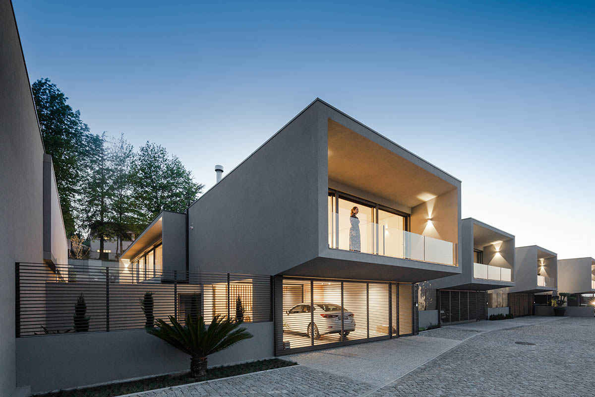 Grupo Zegnea's linear Portuguese houses create fluidity of space with large openings towards nature