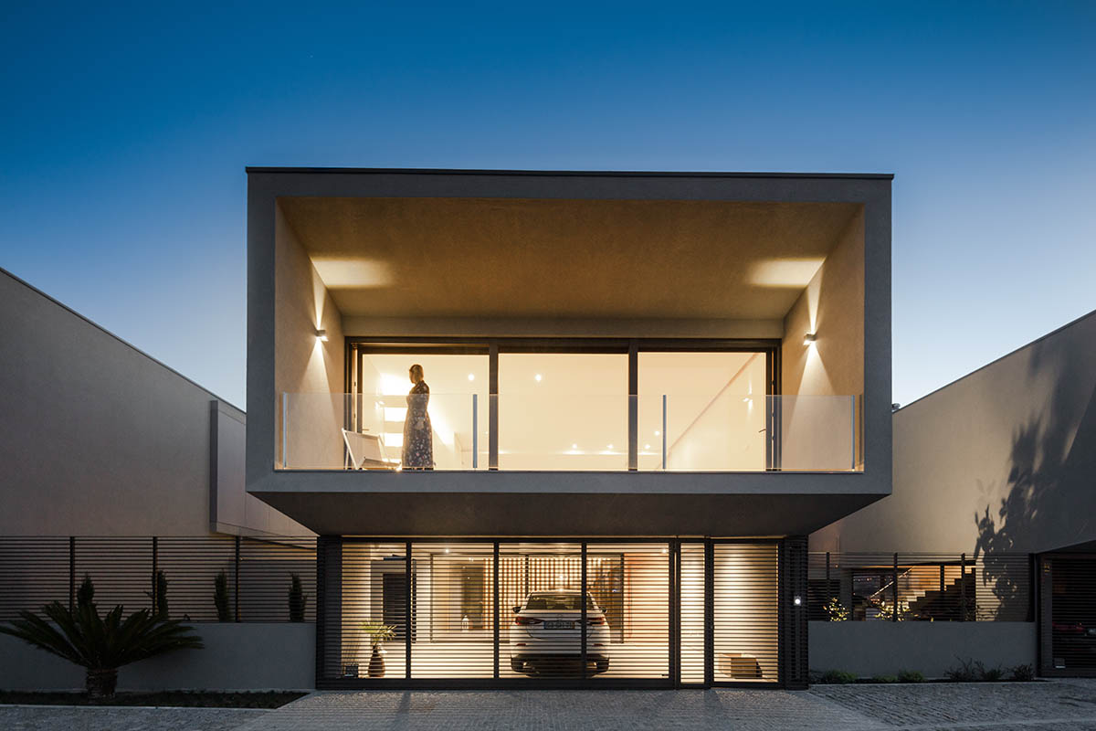 Grupo Zegnea's linear Portuguese houses create fluidity of space with large openings towards nature