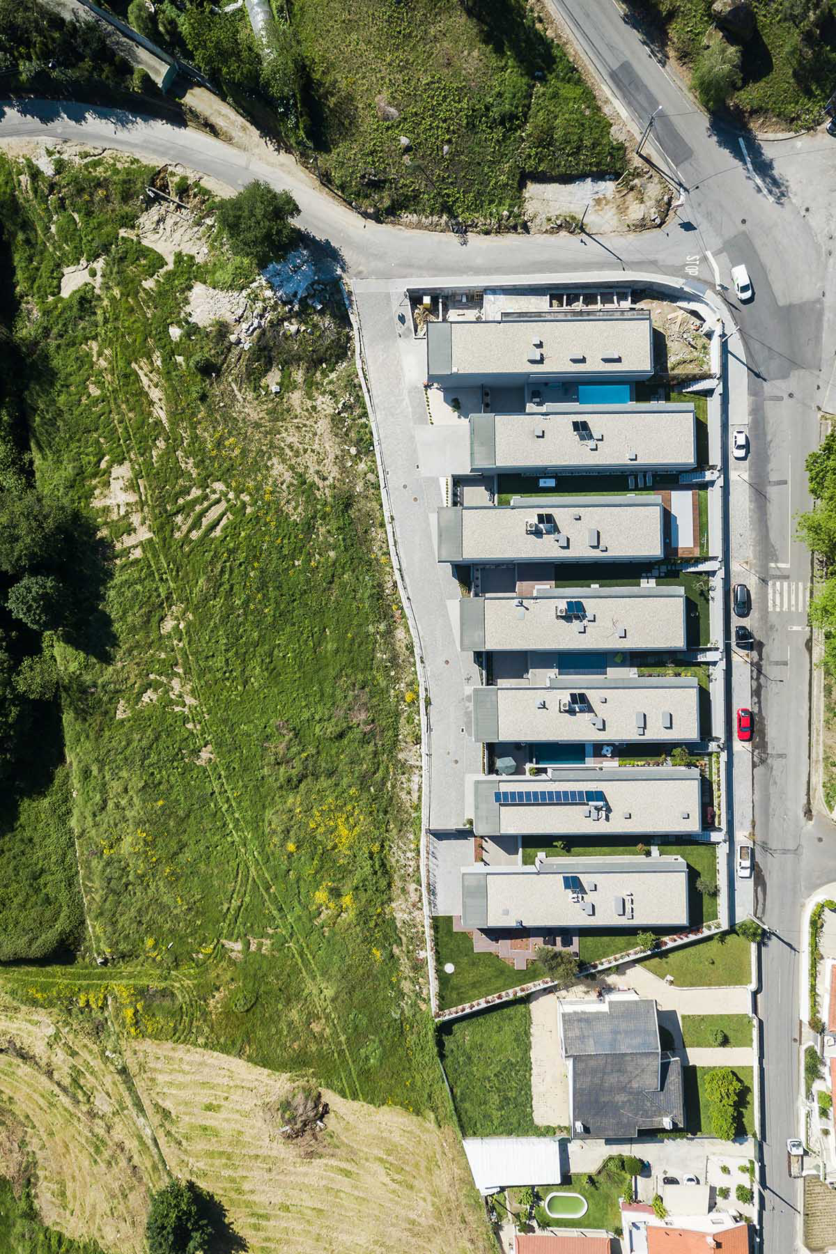 Grupo Zegnea's linear Portuguese houses create fluidity of space with large openings towards nature