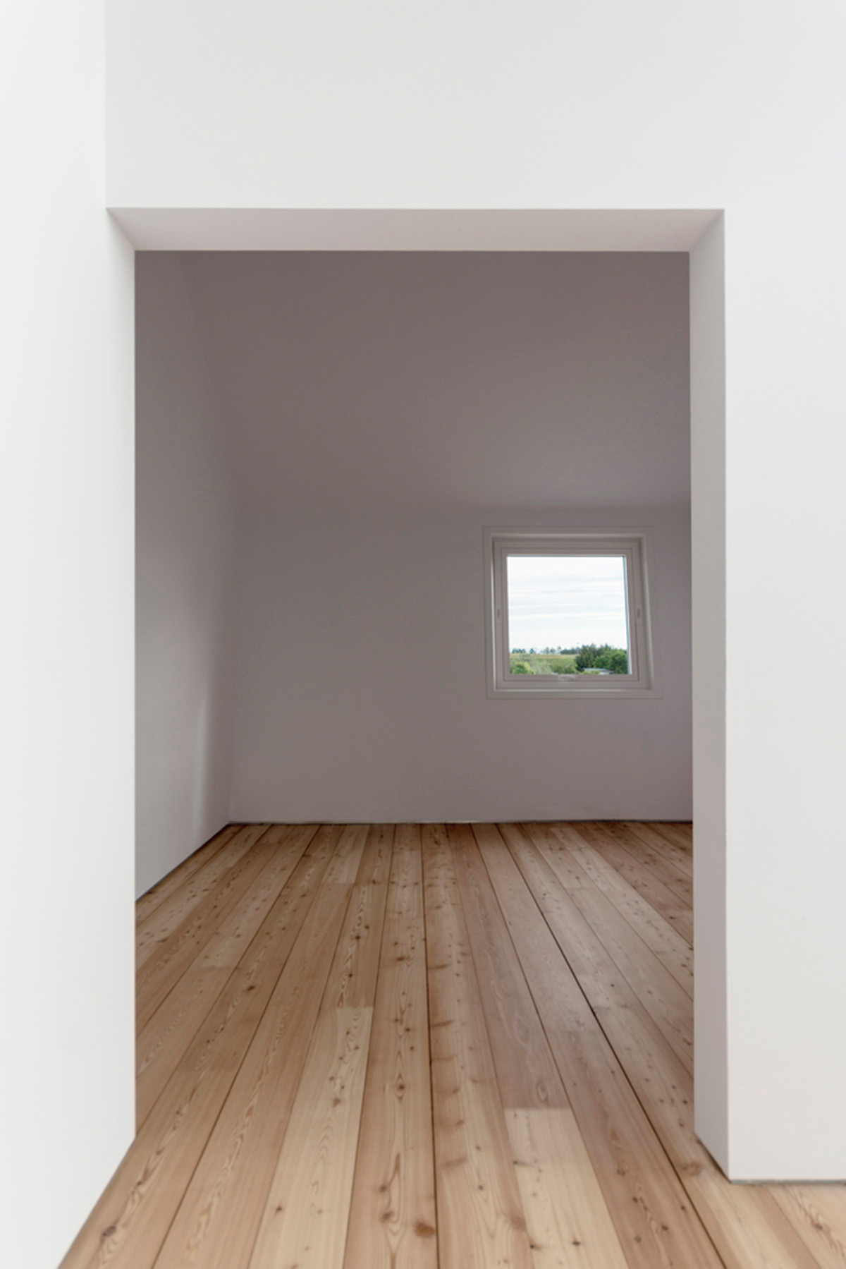 LDA.iMdA architetti associati built modular house raised on stilts in the middle of orchard in Italy