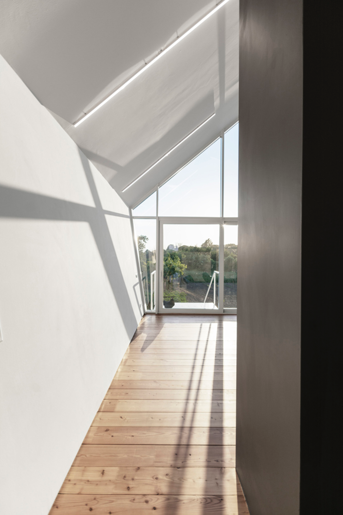 LDA.iMdA architetti associati built modular house raised on stilts in the middle of orchard in Italy