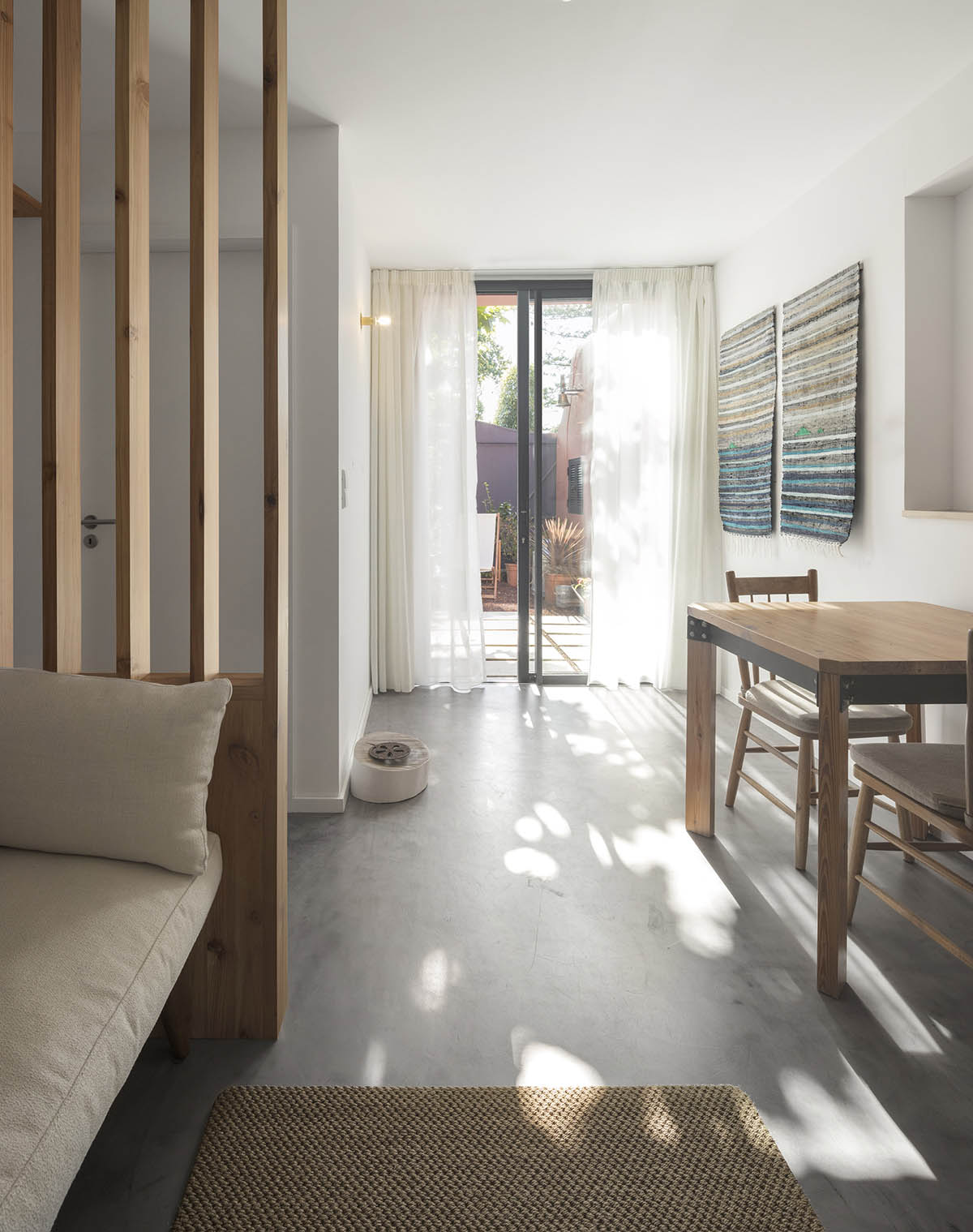 Mezzo Atelier transforms old barn into guesthouses featuring different hues of pink