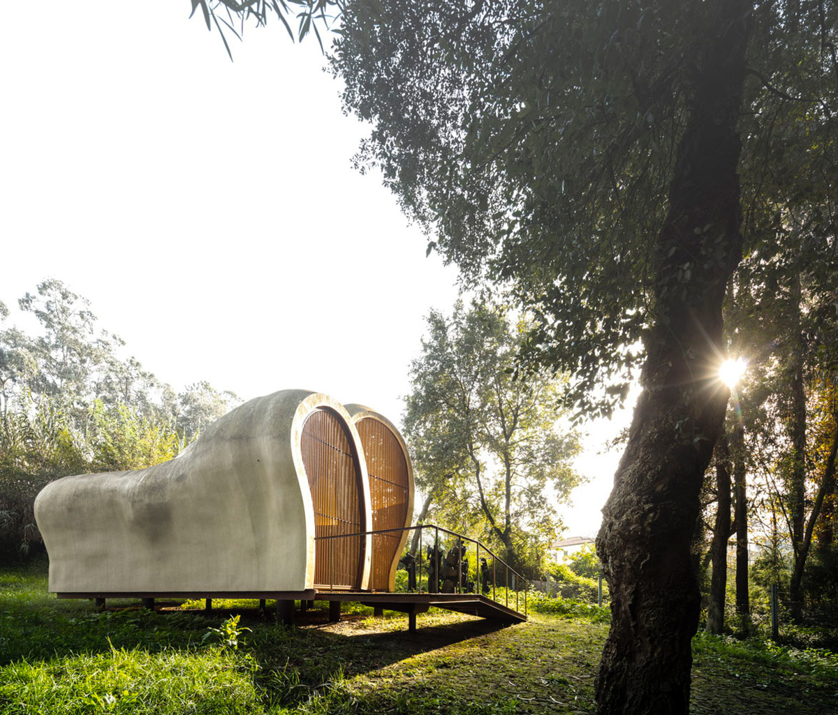 Super small cave-like art gallery by FCC Arquitectura built on lush green in Portugal