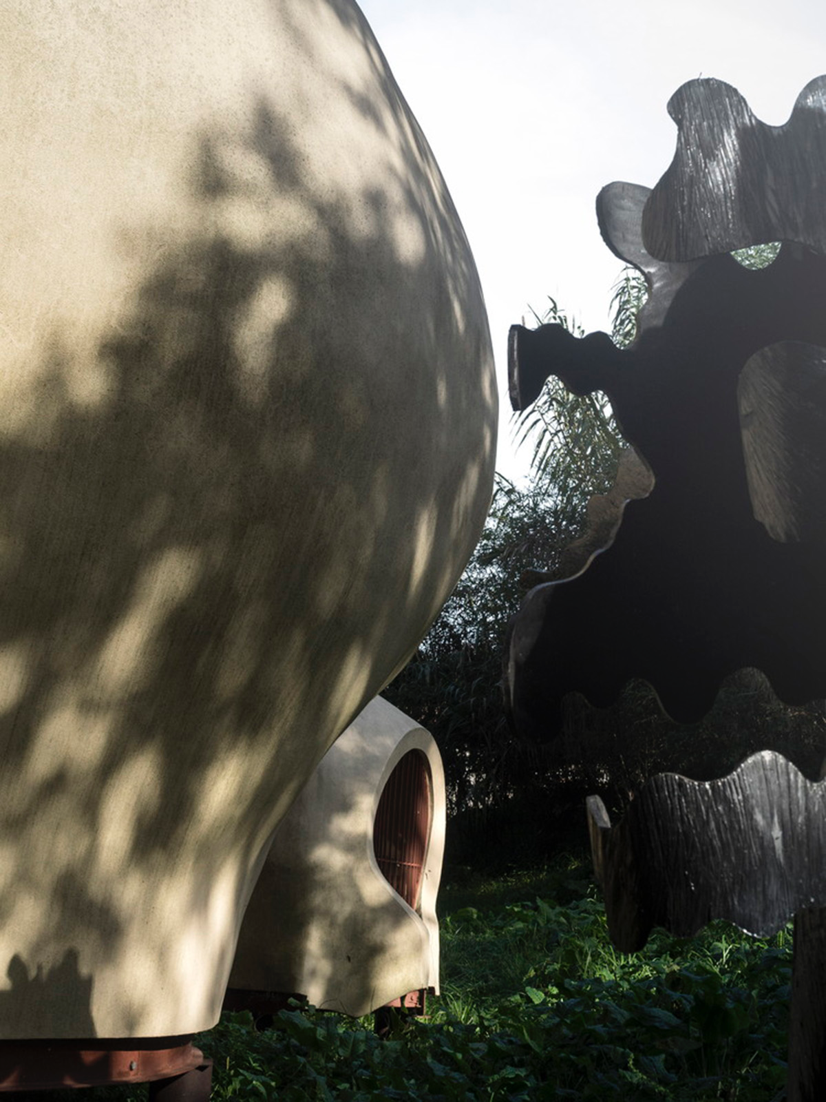 Super small cave-like art gallery by FCC Arquitectura built on lush green in Portugal