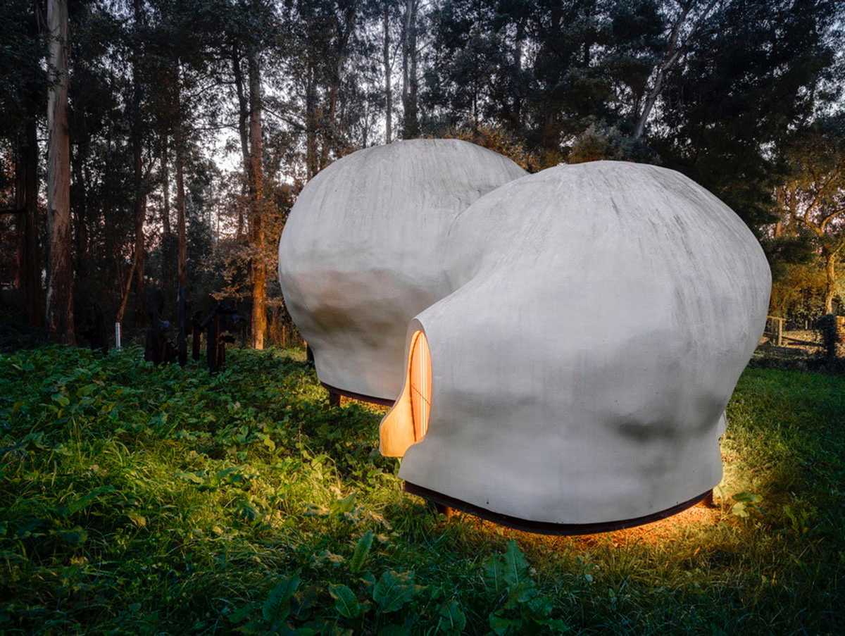 Super small cave-like art gallery by FCC Arquitectura built on lush green in Portugal