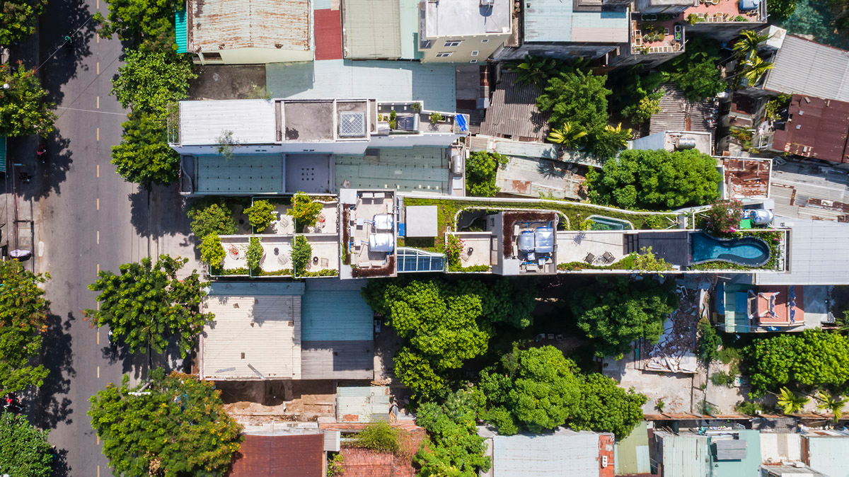 Ho Khue Architects brings jungle life into a terraced apartment building in the Da Nang City, Vietnam