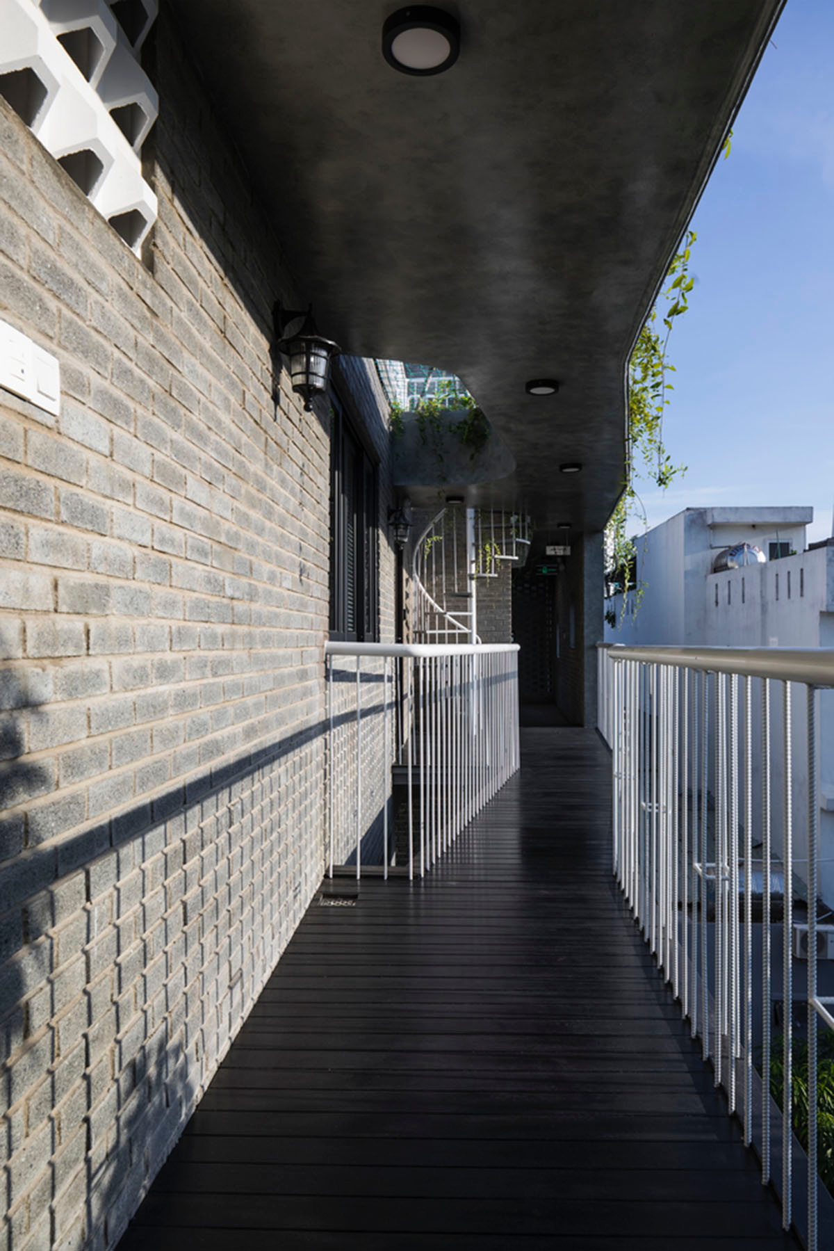 Ho Khue Architects brings jungle life into a terraced apartment building in the Da Nang City, Vietnam