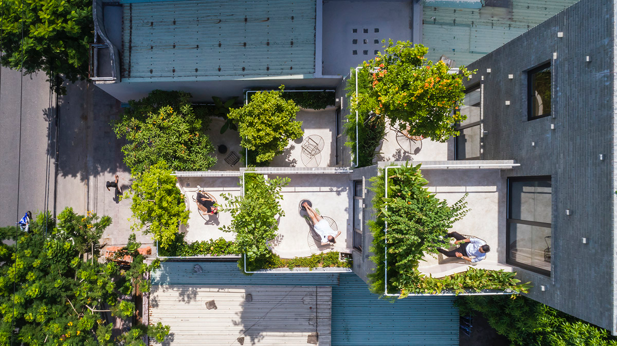Ho Khue Architects brings jungle life into a terraced apartment building in the Da Nang City, Vietnam
