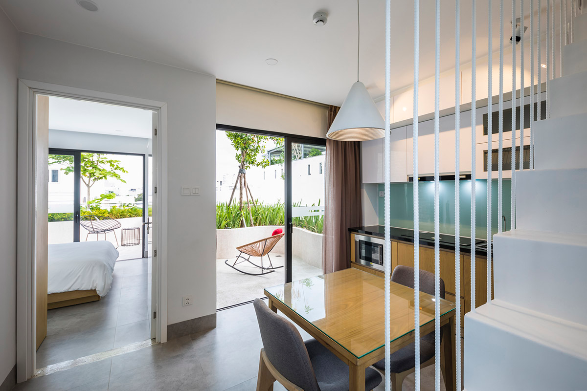 Ho Khue Architects brings jungle life into a terraced apartment building in the Da Nang City, Vietnam