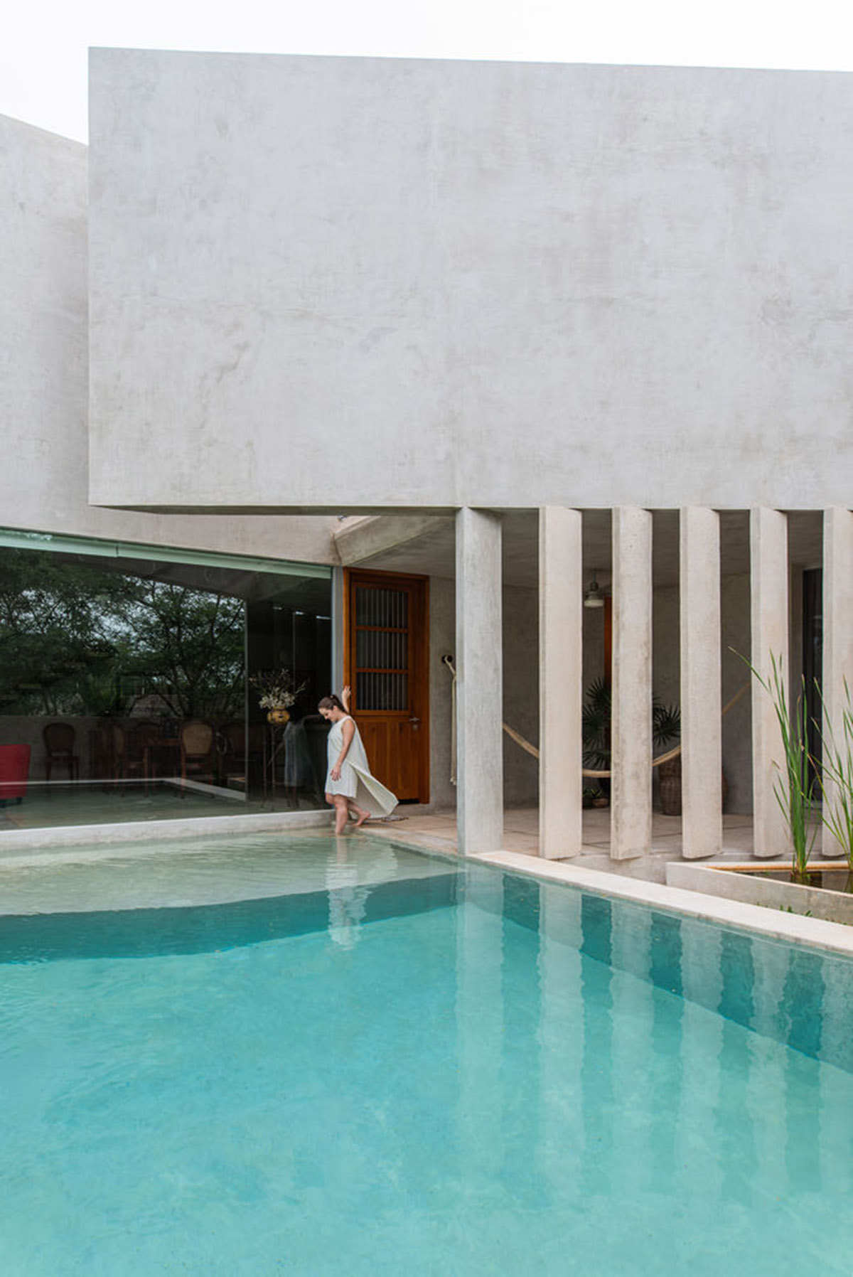 Natural-toned detached house by TACO features dynamic open spaces and backyards in Mexico
