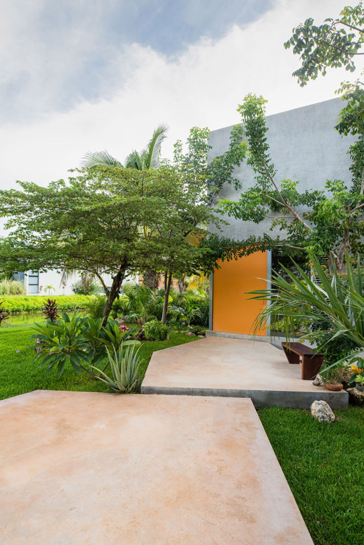 Natural-toned detached house by TACO features dynamic open spaces and backyards in Mexico