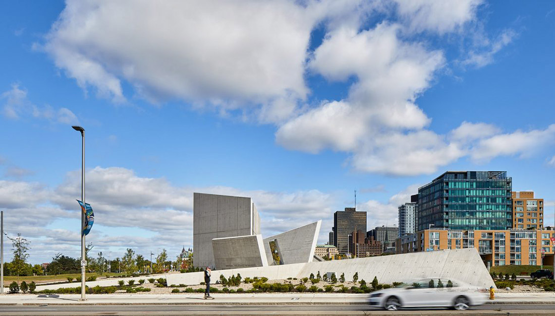 Daniel Libeskind’s Holocaust Monument features fragmented concrete walls creating rough landscape