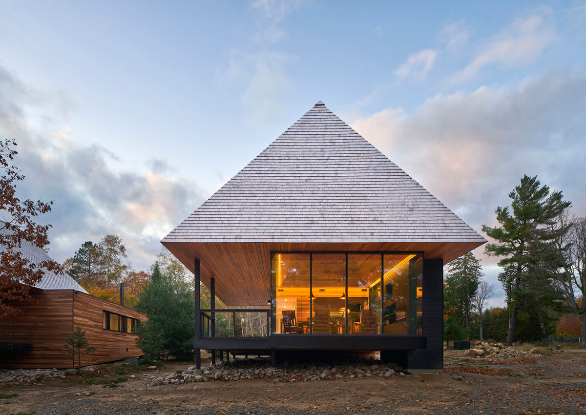 Mackay-Lyons Sweetapple Architects completes island cabins with extruded roofs among pine trees