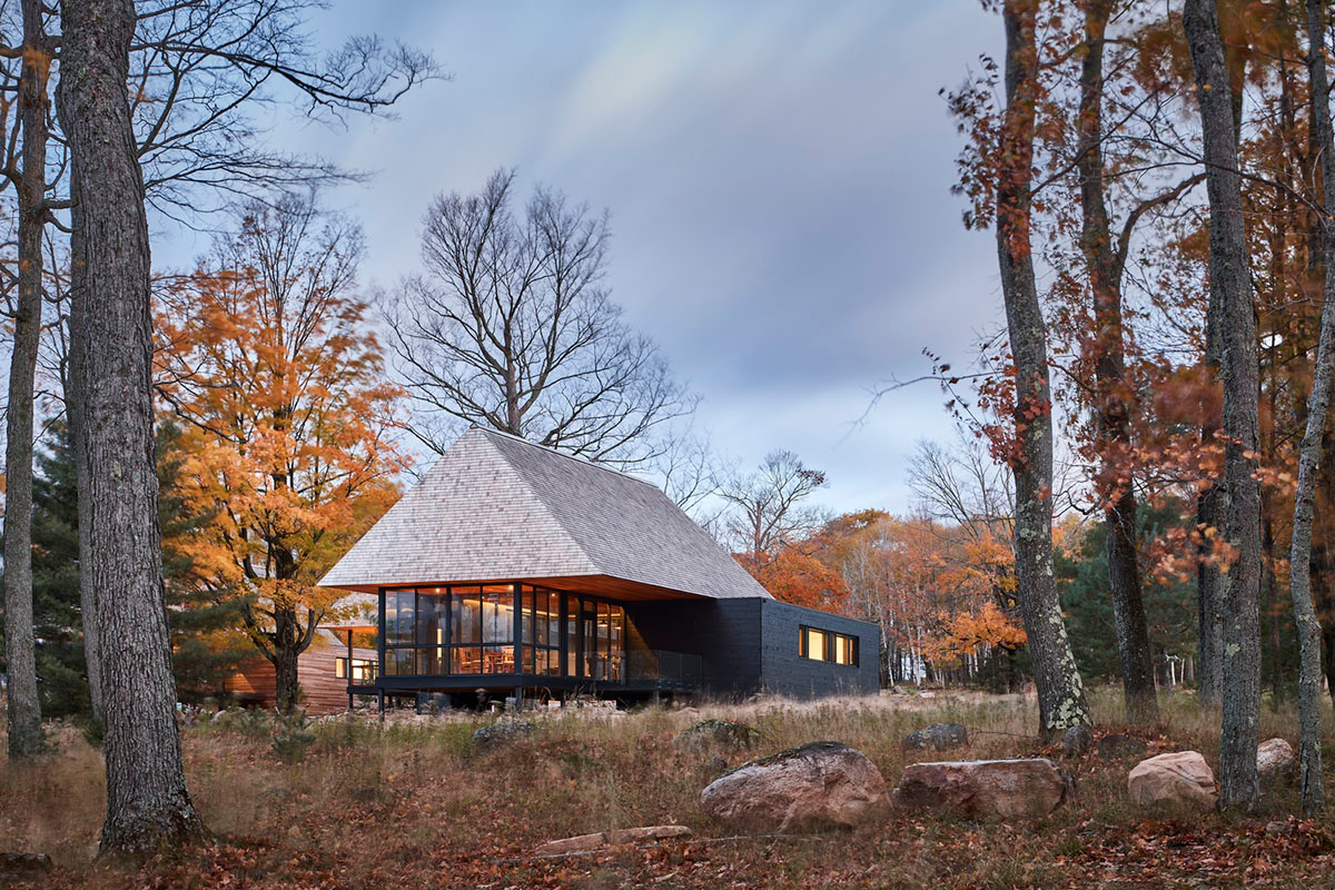 Mackay-Lyons Sweetapple Architects completes island cabins with extruded roofs among pine trees