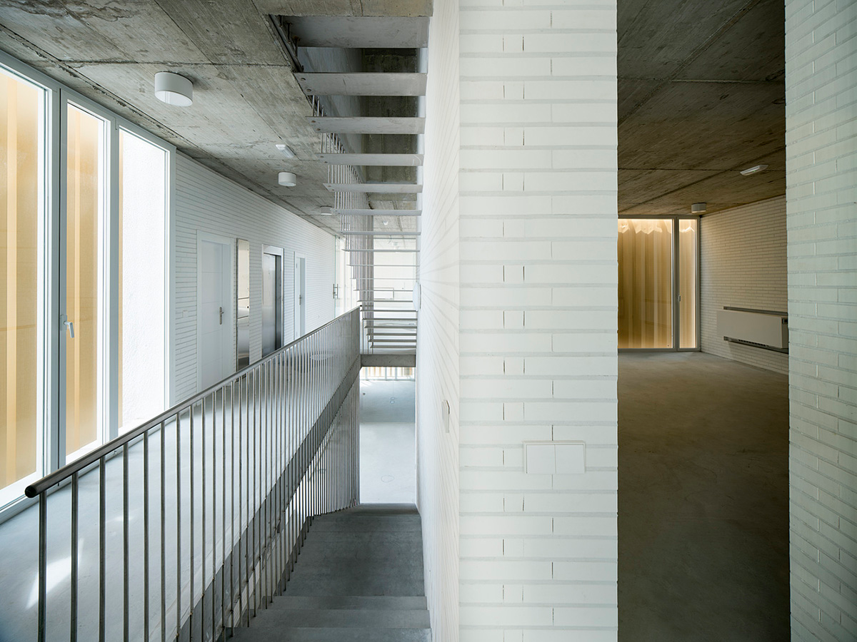 White cubic volumes combined with inward system of patios to create zero-energy Port Operations HQ