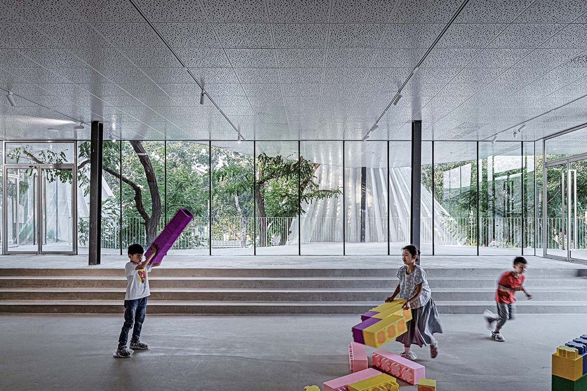 Archstudio converts old art gallery into a new art center with translucent metal curtains in Beijing