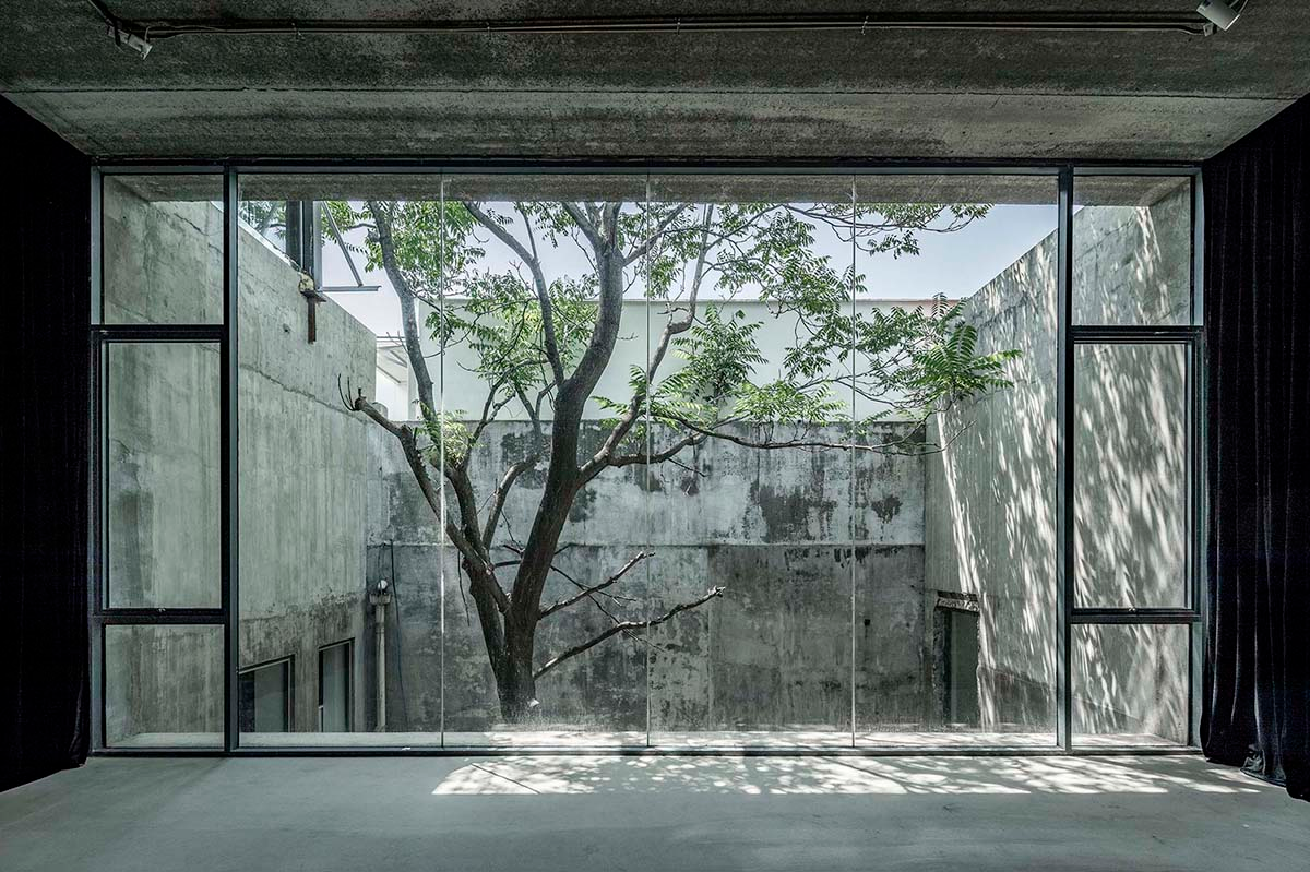 Archstudio converts old art gallery into a new art center with translucent metal curtains in Beijing