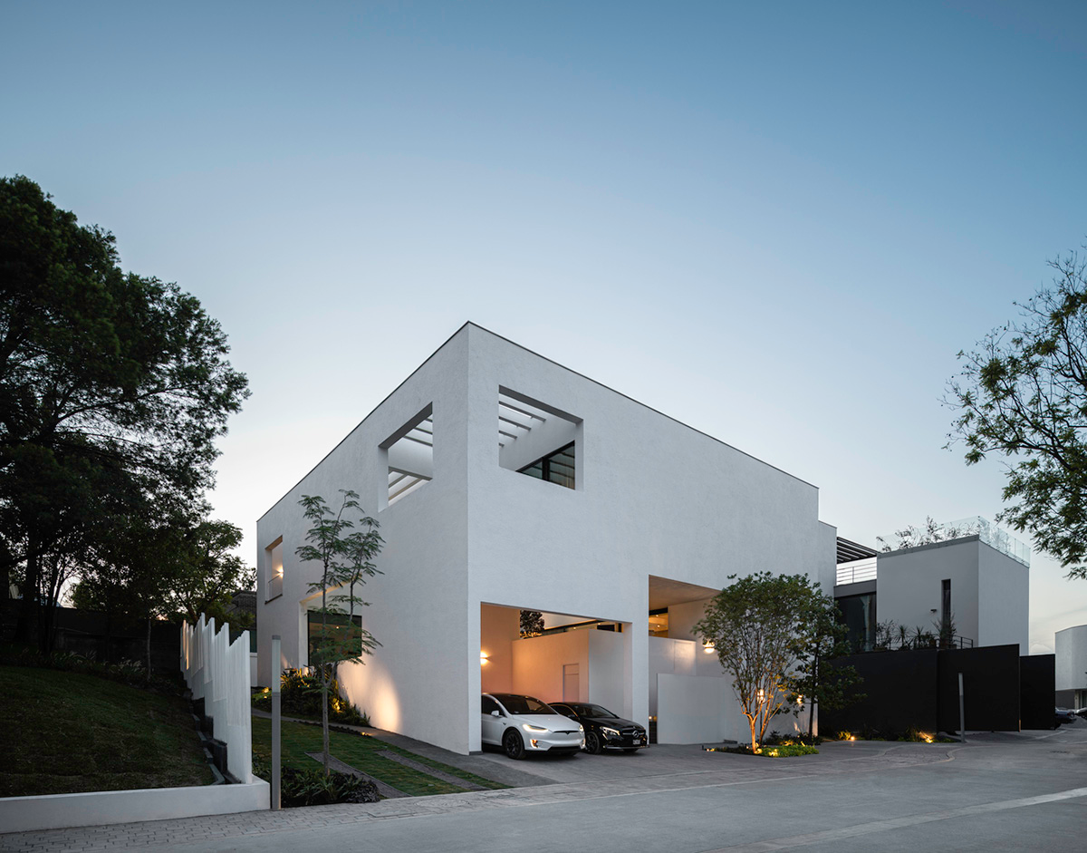 Cadaval & Solà-Morales' white excavated house features porous interior that expands activities