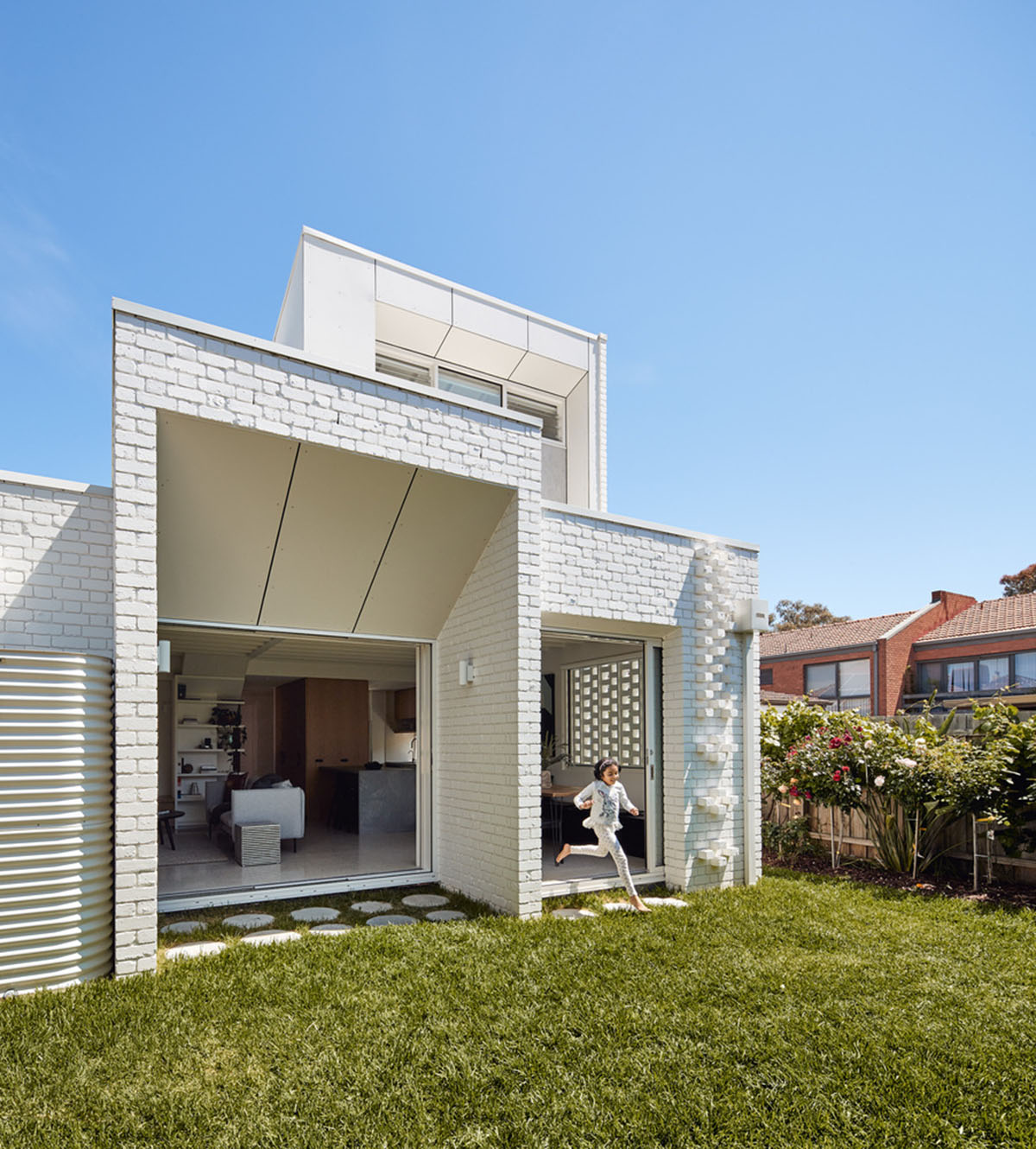 Atelier Red+Black built white Cascade House that features different patterns of brick in Melbourne