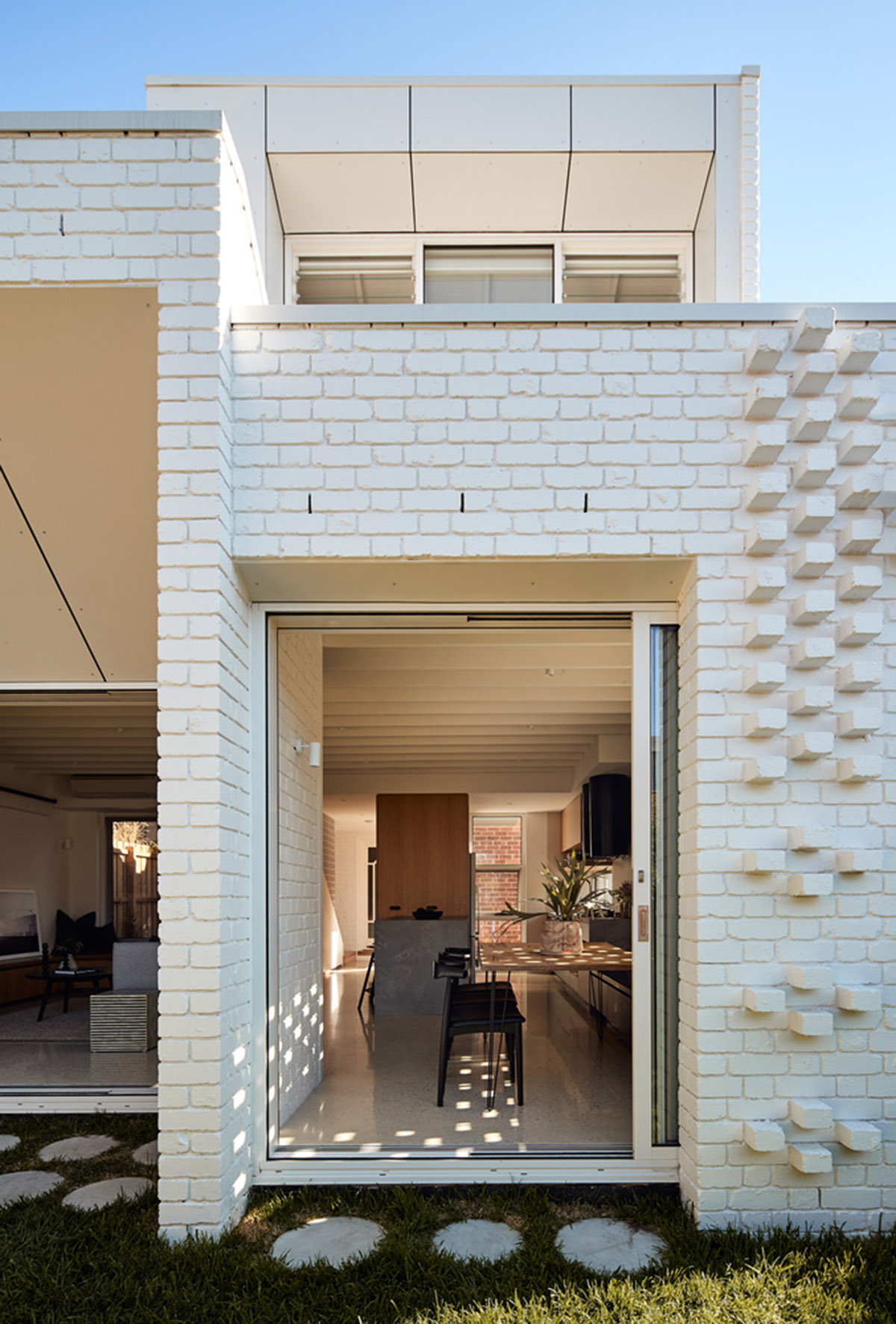 Atelier Red+Black built white Cascade House that features different patterns of brick in Melbourne