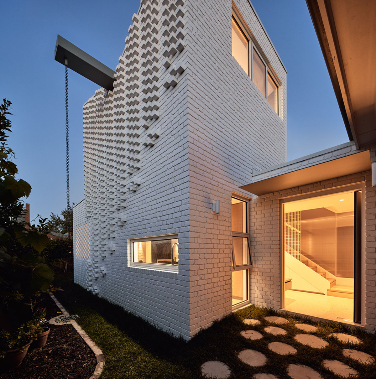 Atelier Red+Black built white Cascade House that features different patterns of brick in Melbourne