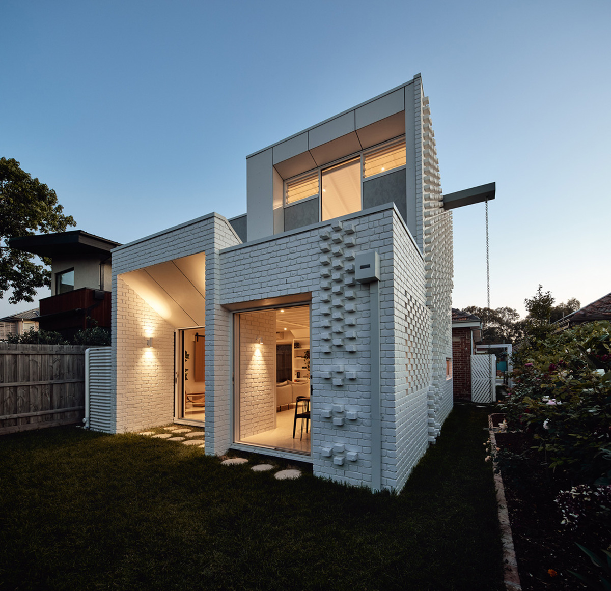 Atelier Red+Black built white Cascade House that features different patterns of brick in Melbourne