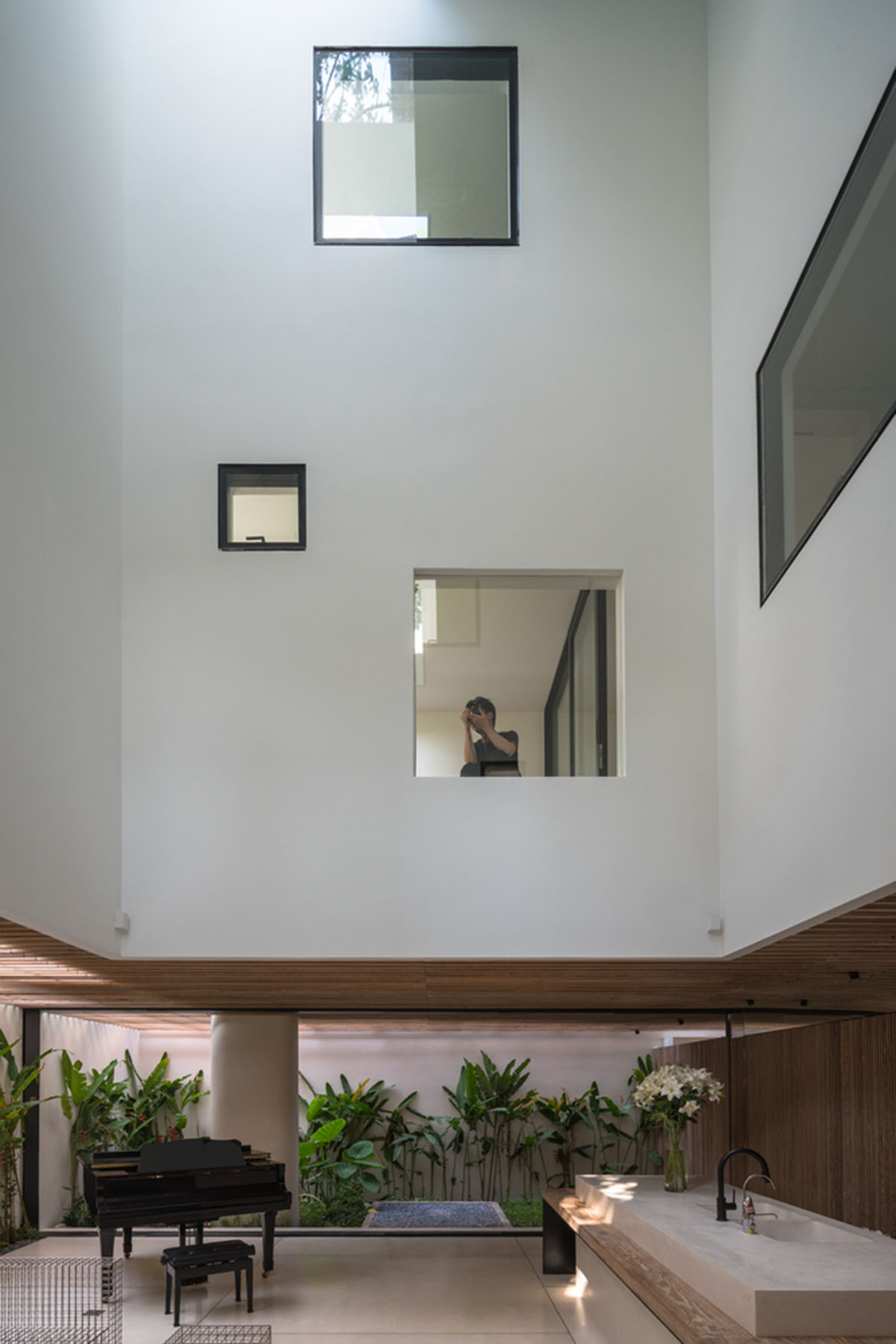 MIA Design Studio compensates the lack of green spaces of Vietnam with planted pop-up balconies