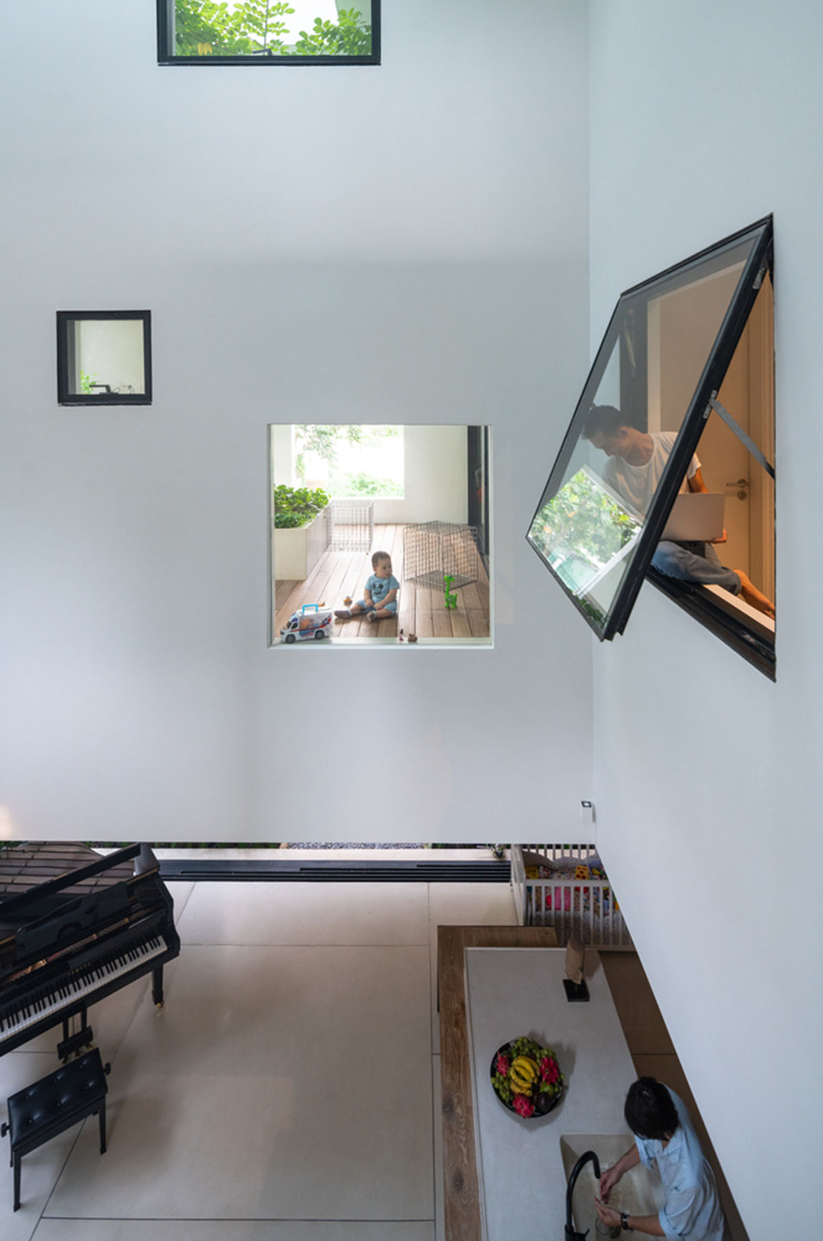 MIA Design Studio compensates the lack of green spaces of Vietnam with planted pop-up balconies