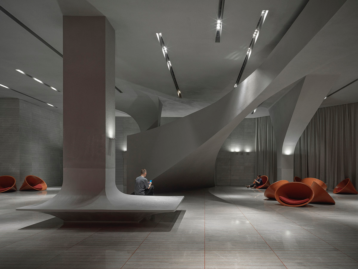 Greyscale interior provides acoustically comfortable space for a cinema by One Plus Partnership