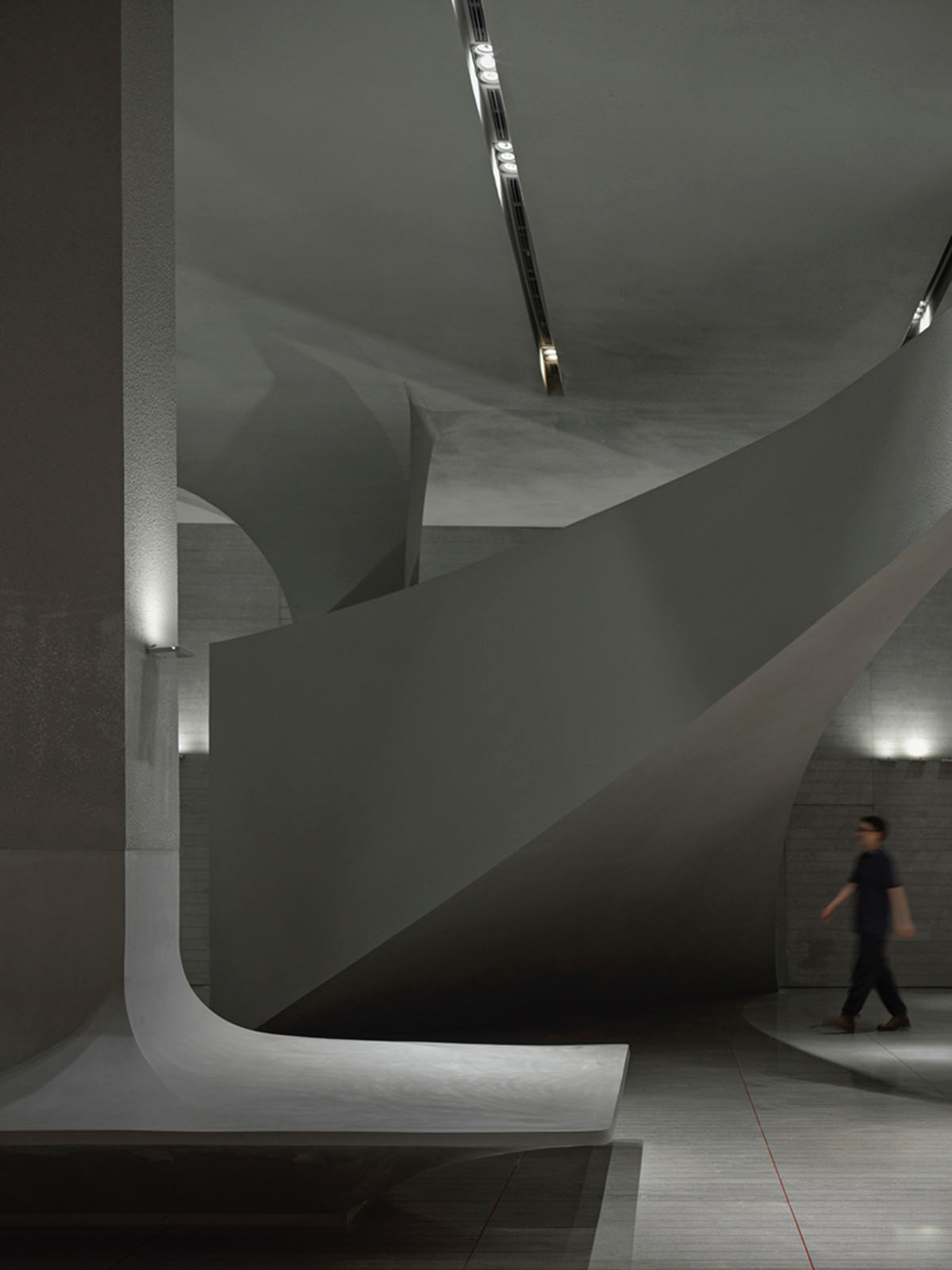 Greyscale interior provides acoustically comfortable space for a cinema ...