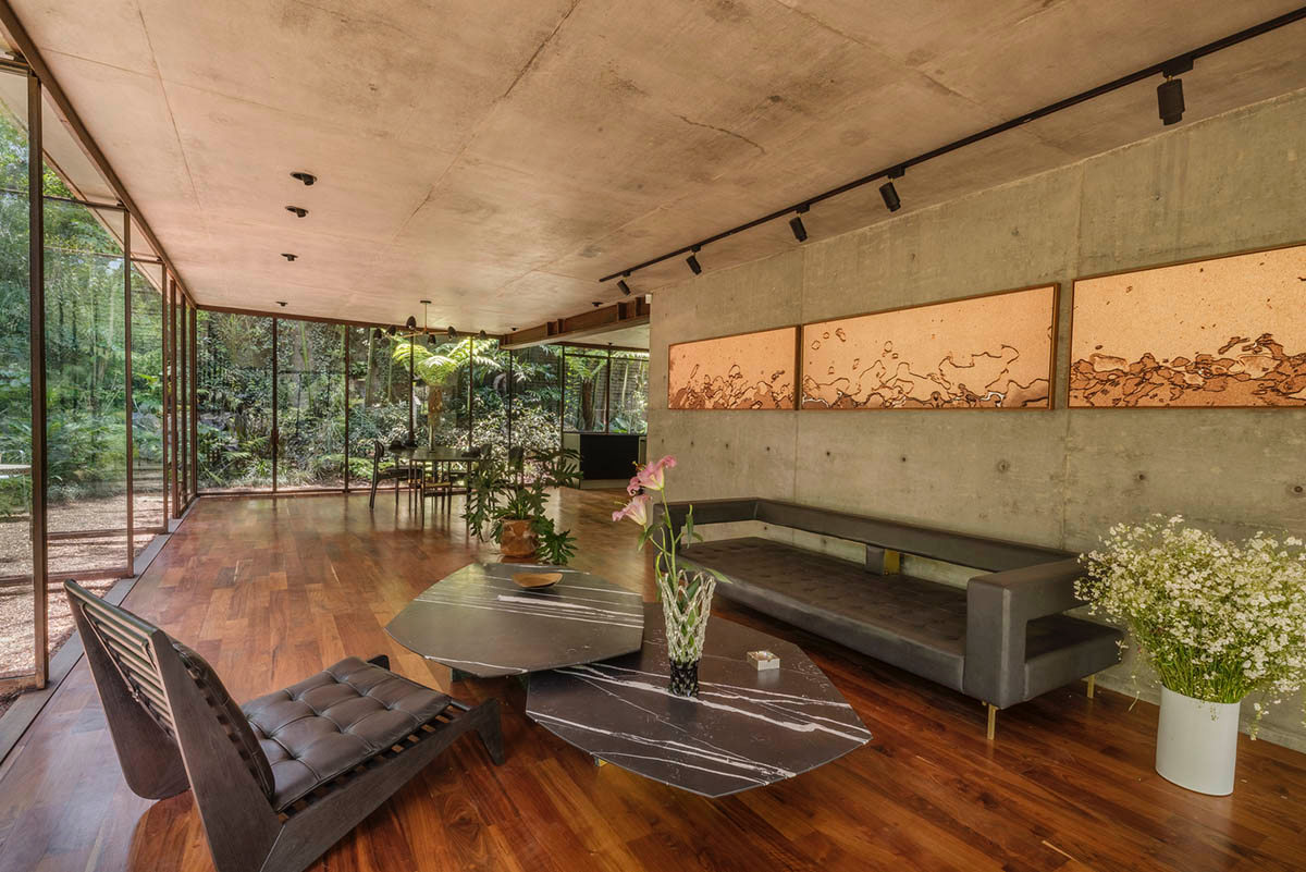 Triangular and faceted green terraces provide generous open spaces for this residence by Vertebral