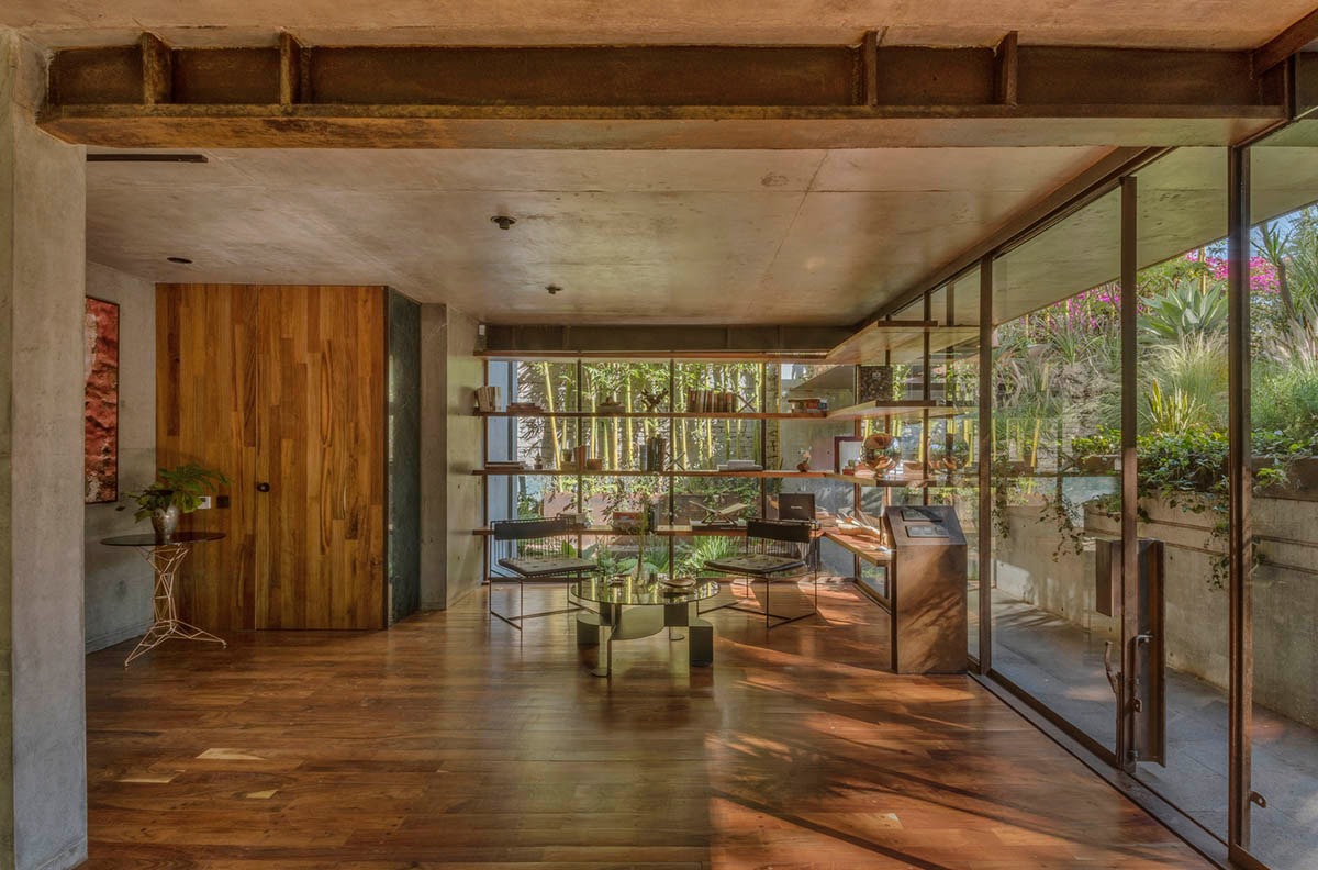 Triangular and faceted green terraces provide generous open spaces for this residence by Vertebral