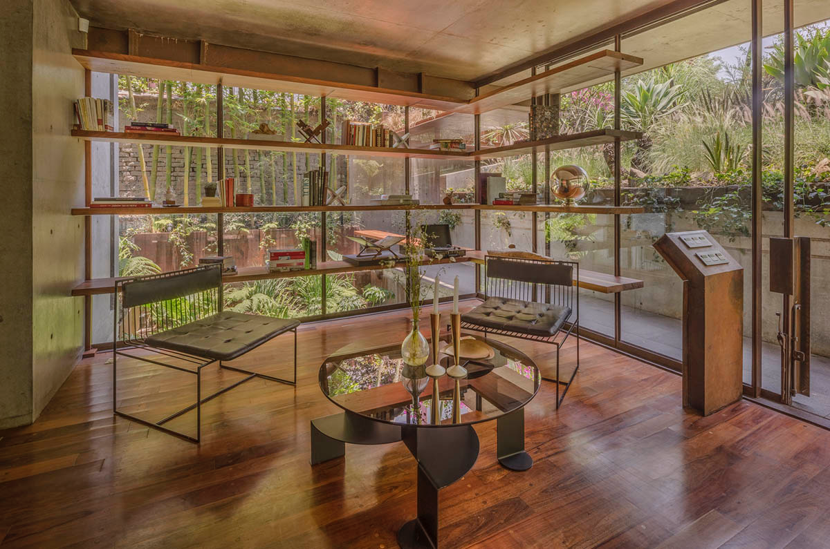 Triangular and faceted green terraces provide generous open spaces for this residence by Vertebral