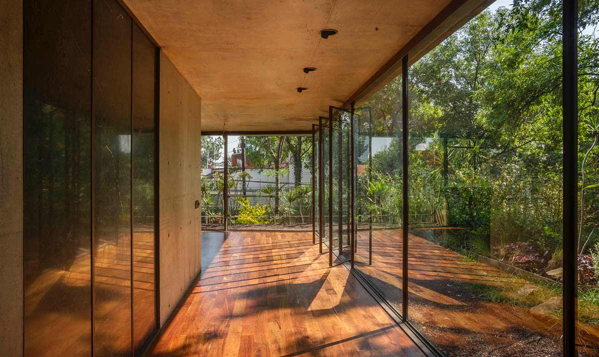 Triangular and faceted green terraces provide generous open spaces for this residence by Vertebral