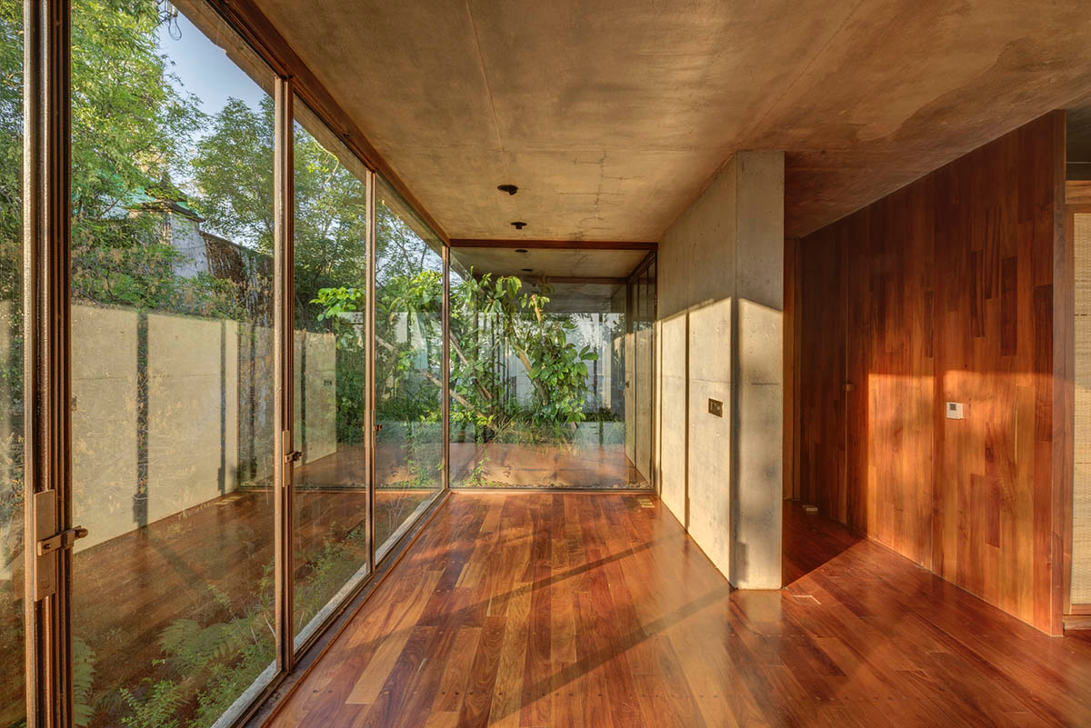 Triangular and faceted green terraces provide generous open spaces for this residence by Vertebral