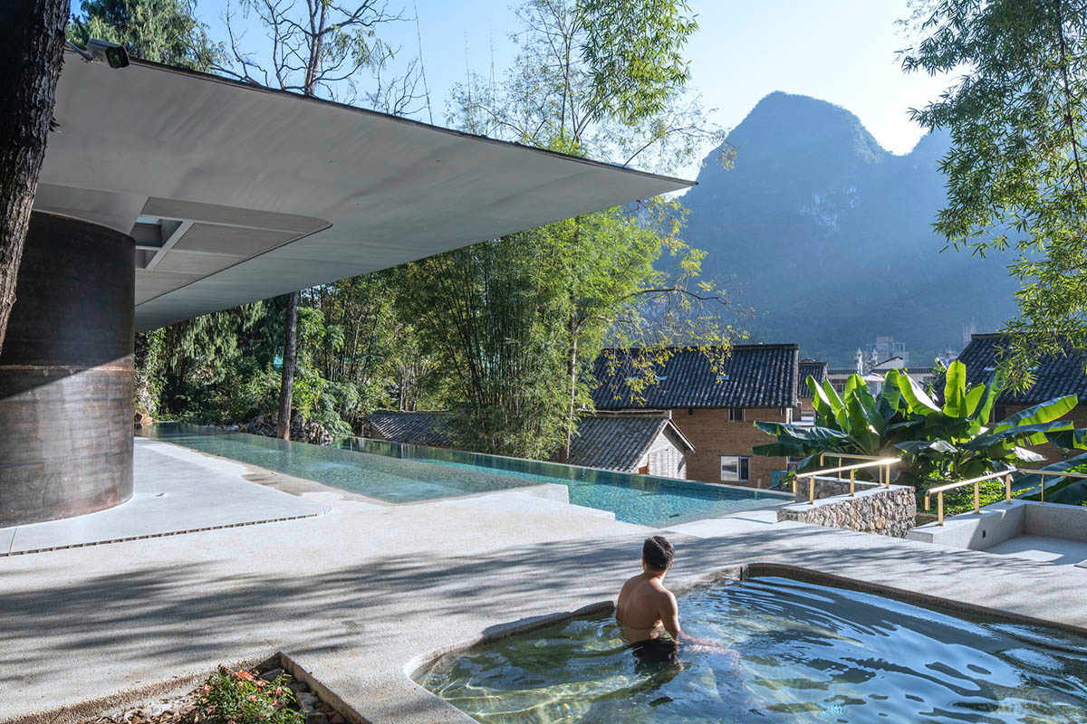 Atelier Liu Yuyang Architects built glassless yoga pavilion featuring silver roof set on a hill