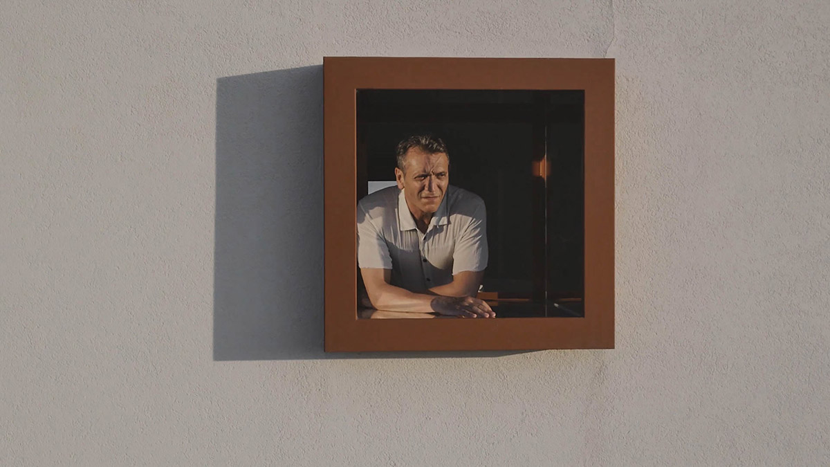 White and reddish strips are used to create cinematic appearance for Border Crossing House in Italy