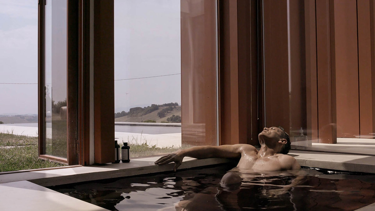 White and reddish strips are used to create cinematic appearance for Border Crossing House in Italy