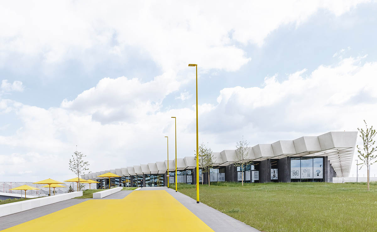 mørk Peep Lav vej COBE creates giant rhomboid roof for Adidas' new headquarters in Germany
